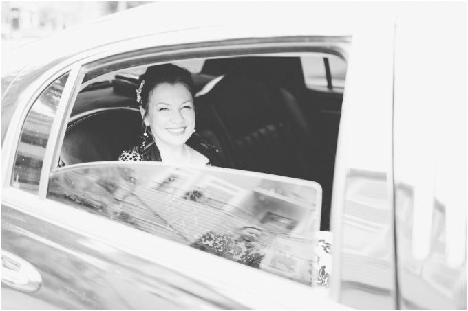 Bride looking really happy in her limousine