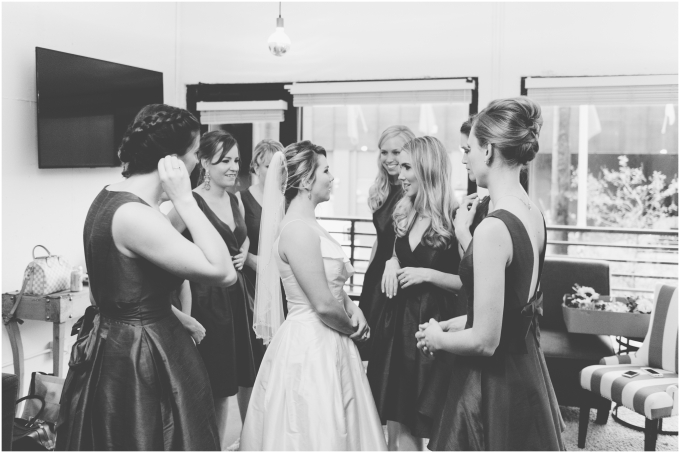 Bride with bridesmaids getting ready for wedding at the Fremont Foundry in Seattle. 
