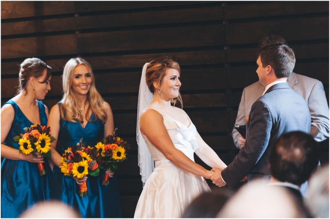 Wedding Ceremony at the Fremont Foundry in Seattle. Image captured by Ardita Kola Photography.