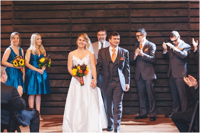 Wedding Ceremony at the Fremont Foundry in Seattle. Image captured by Ardita Kola Photography.