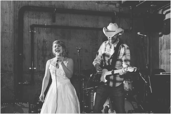Bride singing at her own wedding at the Fremont Foundry in Seattle. Image captured by Ardita Kola Photography.