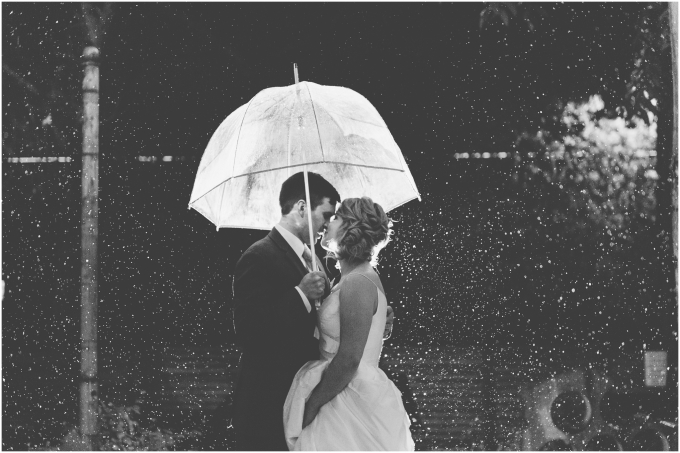 Bride and groom photo in the rain at the Fremont Foundry in Seattle. Image captured by Ardita Kola Photography.