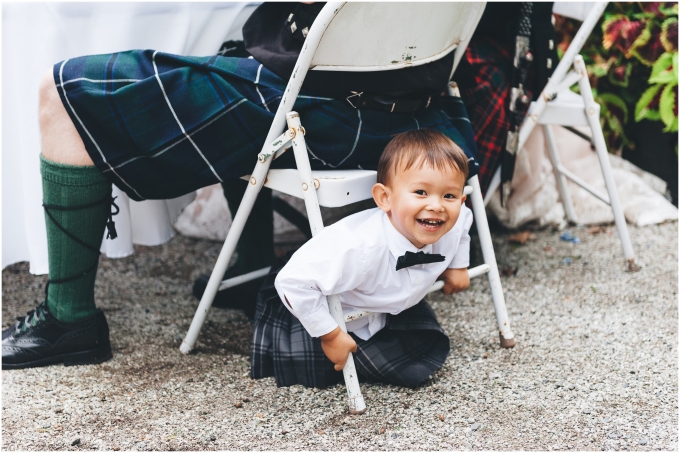 Photo of kid playing at a Scottish American Wedding @ Glen Echo Gardens in Bellingham, WA captured by Ardita Kola Photography