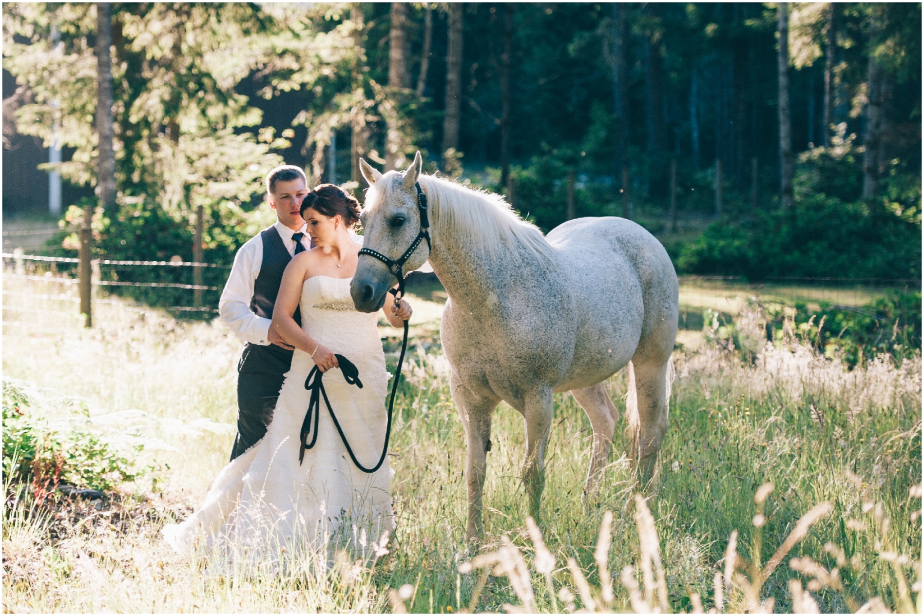Bride and Groom Wedding Photo standing next to a horse by Ardita Kola Photography